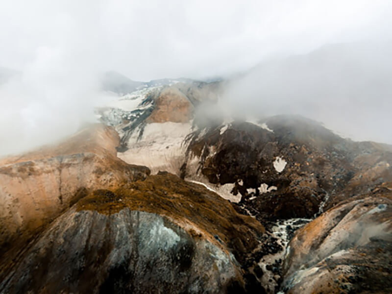 Камчатка с высоты над горами в тумане